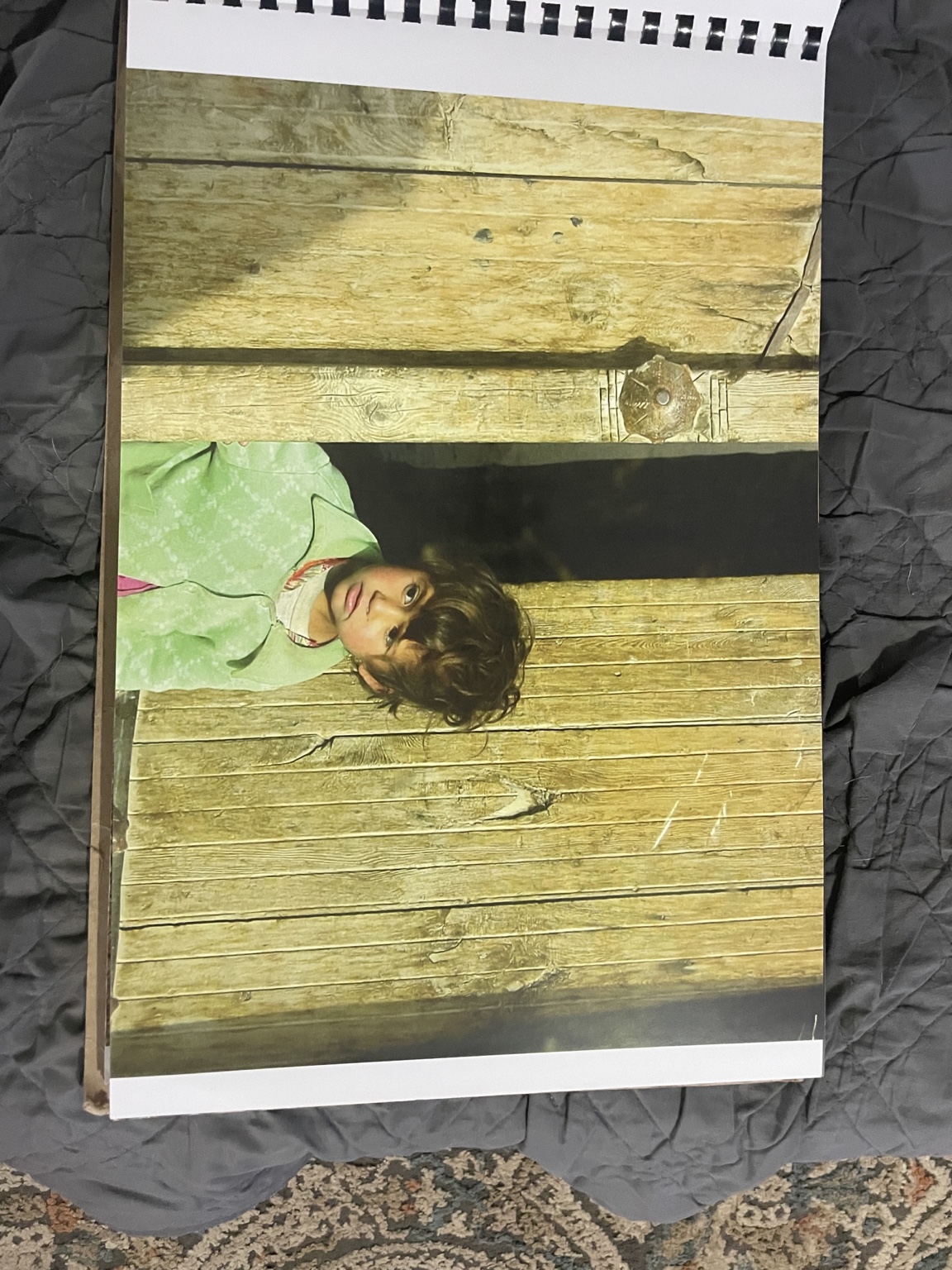 Child looking from a doorway